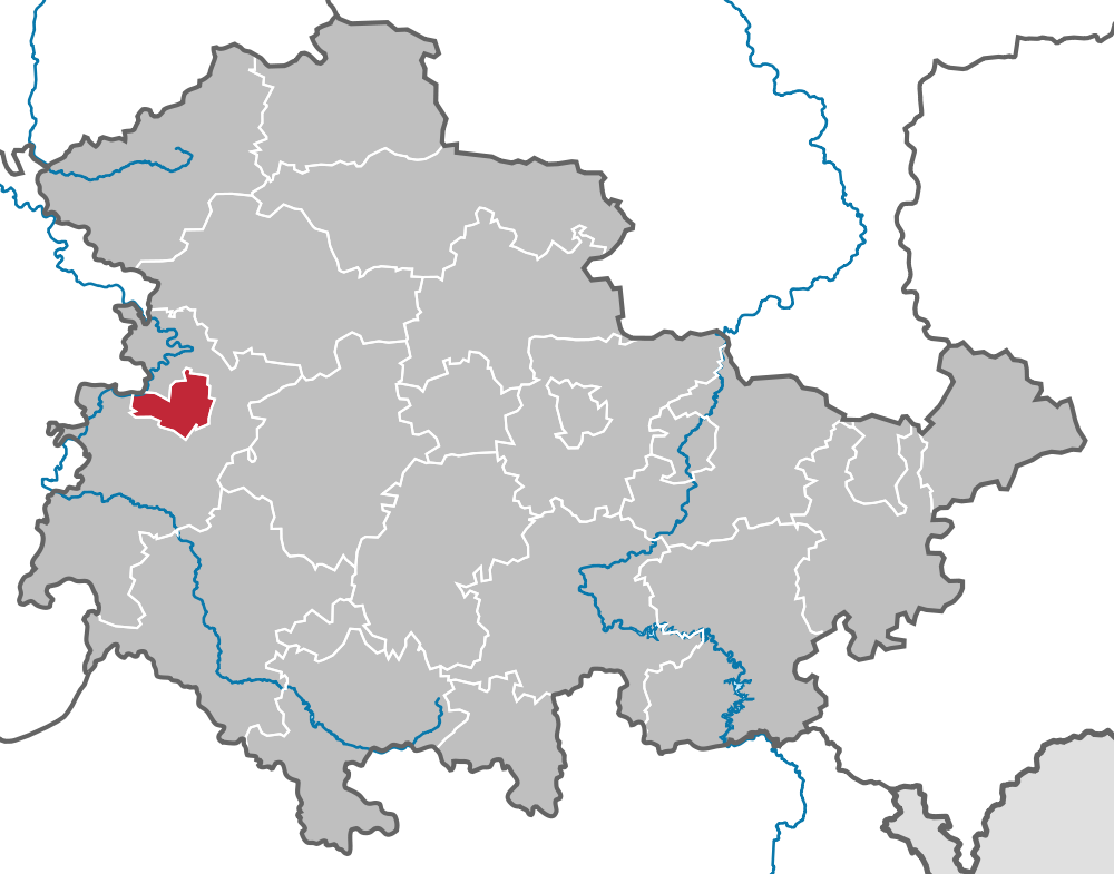 Auf dem Bild ist eine Land·karte von Thüringen. Die Stadt Eisenach ist mit der Farbe Rot angemalt.